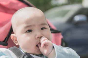 Baby enjoying sunshine outdoors