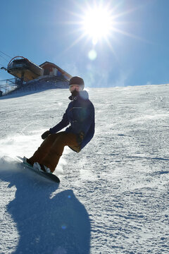a female snowboarder ski on the snow slope