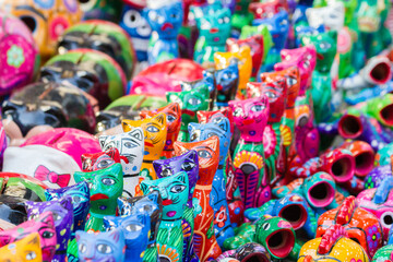 Closeup to small typical cats sculptures from Mexico. This items are sold as souvenirs almost...