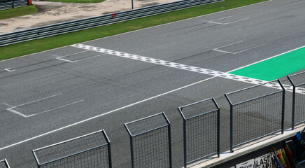 Empty race track finish line background.