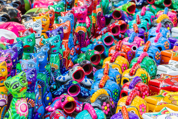Closeup to small typical sculptures from Mexico. This items are sold as souvenirs almost anywhere in this country.