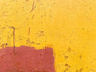 Concrete grunge background yellow and red paint wall texture.