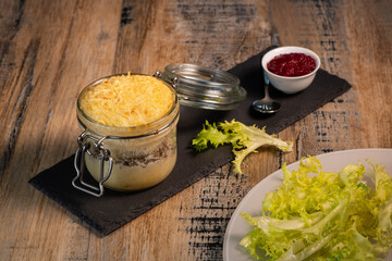 Beef pie recipe with red beet sauce cooked with chili spices and salad