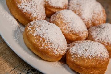 Freshly cooked Apricot jam doughnuts, referred to as jelly doughnuts, donuts in the US