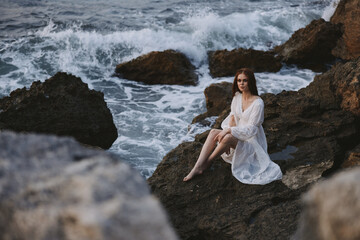 Woman in white dress nature travel wet hair cliff