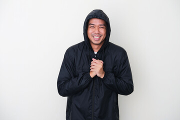 Adult Asian man wearing black warm jacket feeling cold gesture