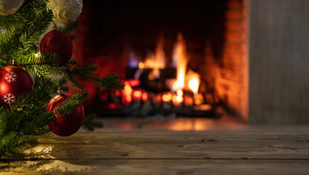 Christmas tree and burning fireplace background. Wooden table desk empty, template