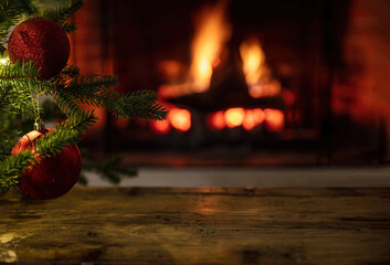 Christmas tree and burning fireplace background. Wooden table desk empty, template