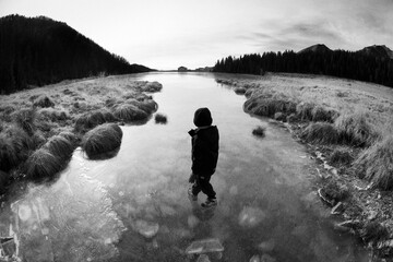 A boy walking in the nature of dolomites