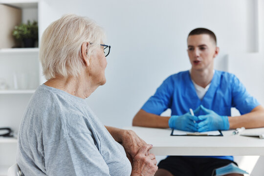 old woman talking to the doctor health treatment