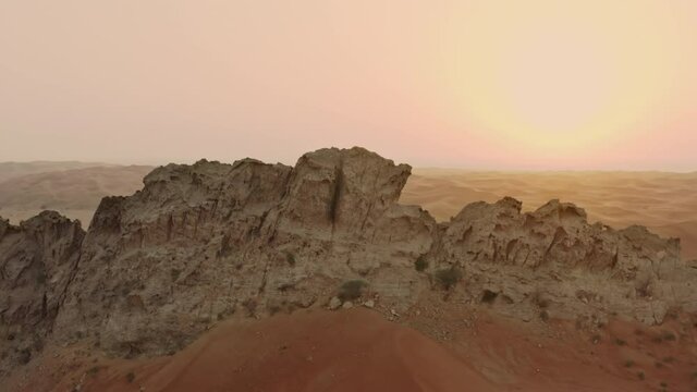 Aerial view of the desert in the UAE. Beautiful nature and landscape with rocky mountains in the desert.