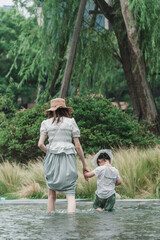 Mother and daughter playing outdoors