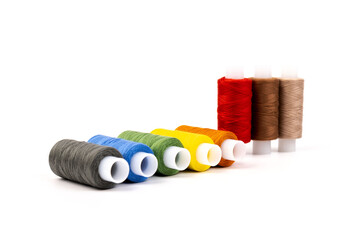 Color sewing threads isolated on white background. Different colors.Bright bobbin thread.