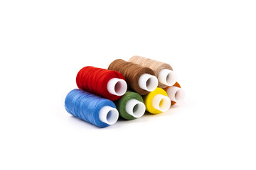 Color sewing threads isolated on white background. Different colors.Bright bobbin thread.