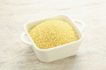 Raw couscous in the bowl