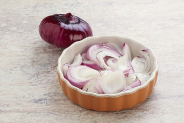 Sliced red onion in the bowl