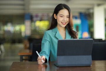 Business woman working on digital tablet touchpad computer