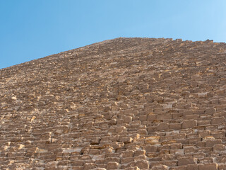 Pyramid of Cheops, a monument of the architectural art of Ancient Egypt, 138 meters high. Close-up. Giza, Cairo, Egypt.