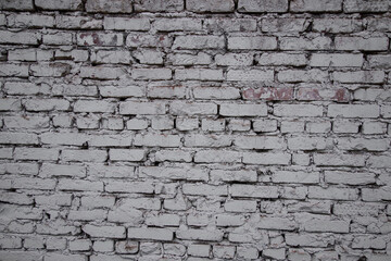 Symmetrical pattern of a white stone wall. Brick background.	