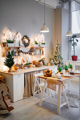 side view. Christmas decor. garlands on decorated in kitchen for new year. 