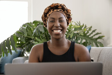 Portrait young Black African gen z woman wearing traditional scarf