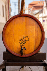 Wine barrel mad from wood in front of the wine celler