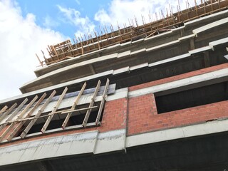 Down to up view of building under construction in the city