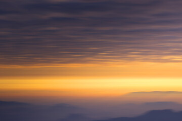 Fototapeta na wymiar mountain at sunrise blur background