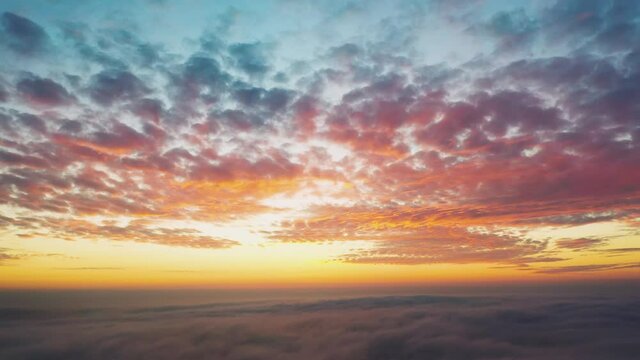 Dawn over the clouds. View from a passenger plane.