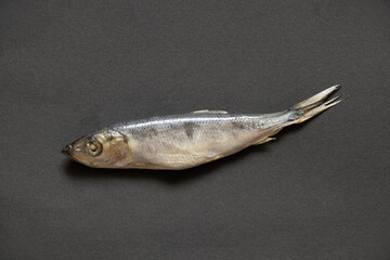 sprat lies on an isolated background, seafood, salted fish