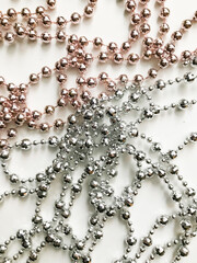 Christmas background of beautiful glass and colorful garlands. Flat lay, top view.