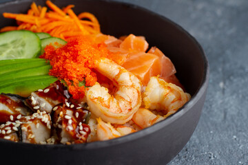Poke with shrimps and salmon in a deep cup