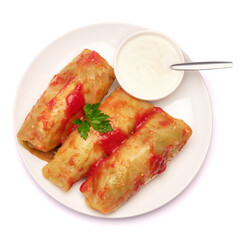 Portion of cabbage rolls stuffed with ground beef and rice with sour cream on a plate