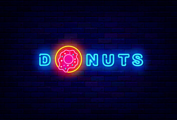 Donuts neon signboard. Shiny emblem for bakery. Sweet bar. Night bright logo. Isolated vector stock illustration