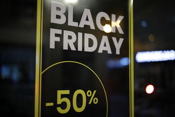 The inscription "Black Friday" on the shop window.  An evening of calm on the eve of big sales in retail chains.  The concept of highlighting the traditional signs of marketing activities.