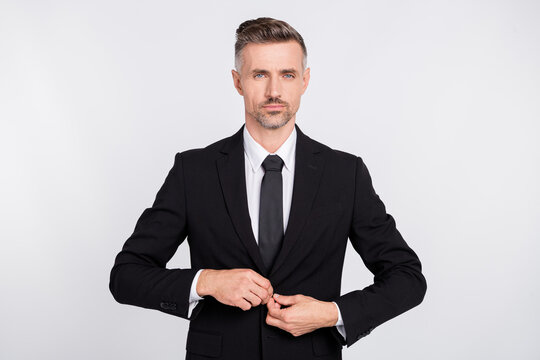Photo of serious attractive mature specialist dressed black suit button up jacket isolated grey color background