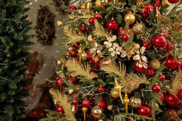 Christmas tree decoration in red and gold colors close up