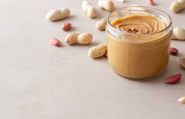 Obraz na płótnie Canvas Peanut butter in a jar. Breakfast. Vegetarian food.