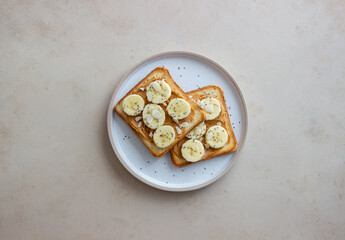Sandwich with peanut butter, banana and chia seeds. Breakfast. Vegetarian food.