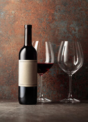 Bottle of red wine with old empty label.