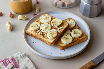 Sandwich with peanut butter, banana and chia seeds. Breakfast. Vegetarian food.