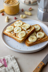 Sandwich with peanut butter, banana and chia seeds. Breakfast. Vegetarian food.