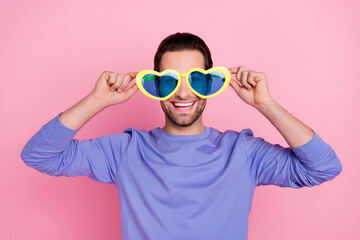 Photo of brunet cool guy wear eyewear blue pullover isolated on pink color background