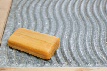 Piece of household soap on a relief washboard.