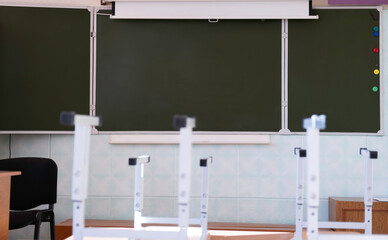 a blackboard in an empty classroom. the concept of vacation, quarantine, remote learning.