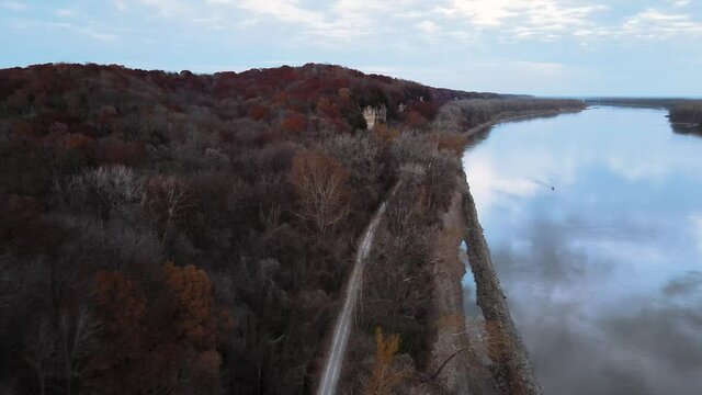 Drone Shot next to the Missouri River. Weldon Spring Lewis and Clark Hiking Trail (Katy Trail). During the autumn season change, red and yellow trees.