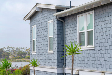 Side view of a house with light gray shingles sidings at La Jolla, California