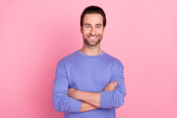 Fototapeta premium Photo of brunet nice guy crossed palms wear blue sweater isolated on pink color background