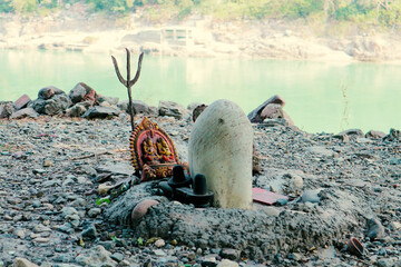 An impromptu altar to Shiva on the banks of the Ganges River in Rishikesh, India.