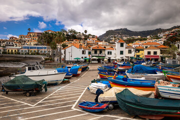Fototapeta na wymiar A small port with colorful boats in Madeira.